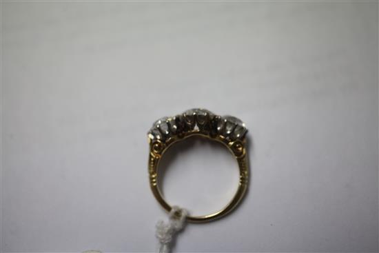 A Victorian style gold three stone diamond ring, size O.